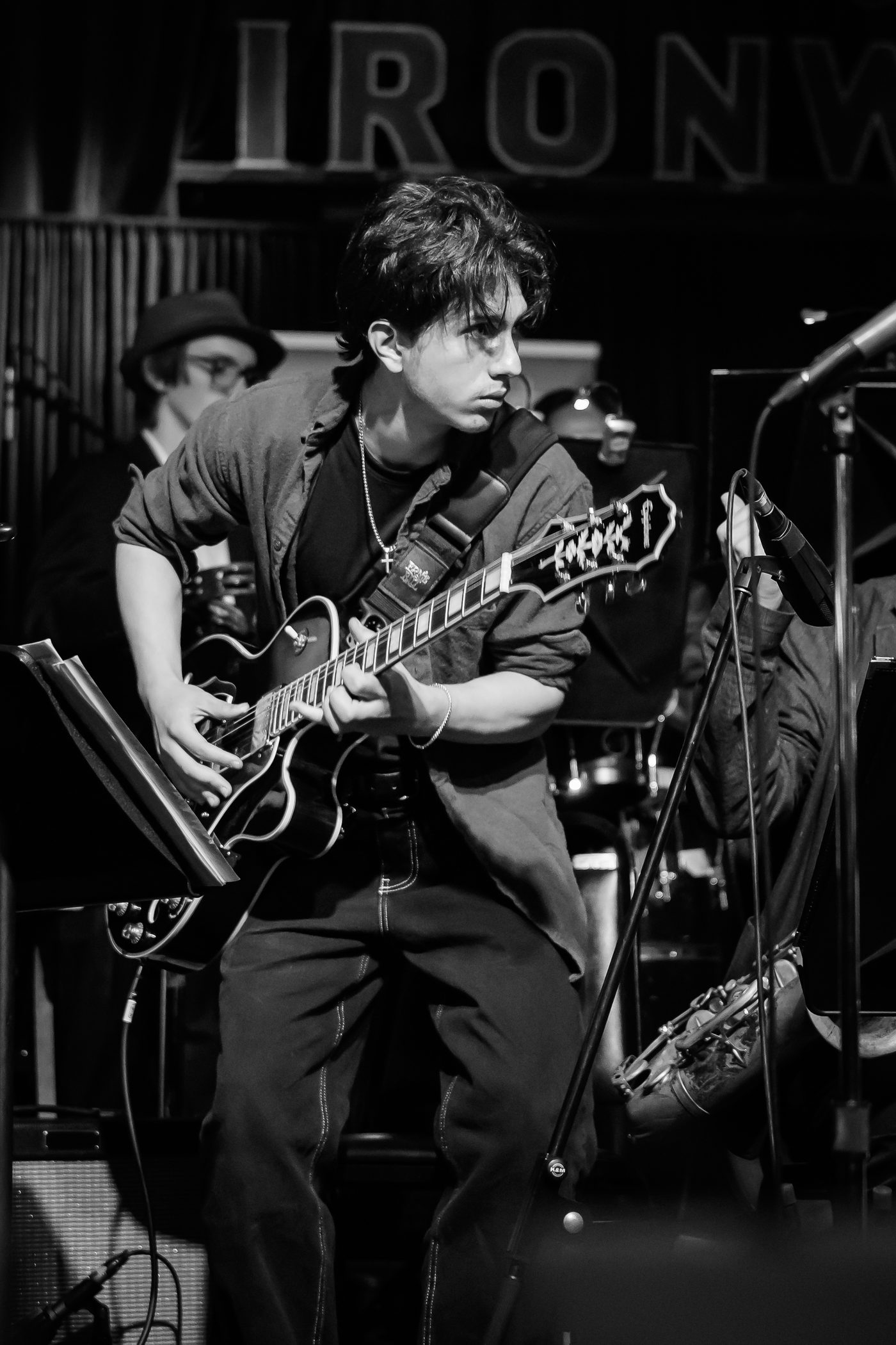 Simon Maxam playing guitar live at Ironwood Stage, Calgary